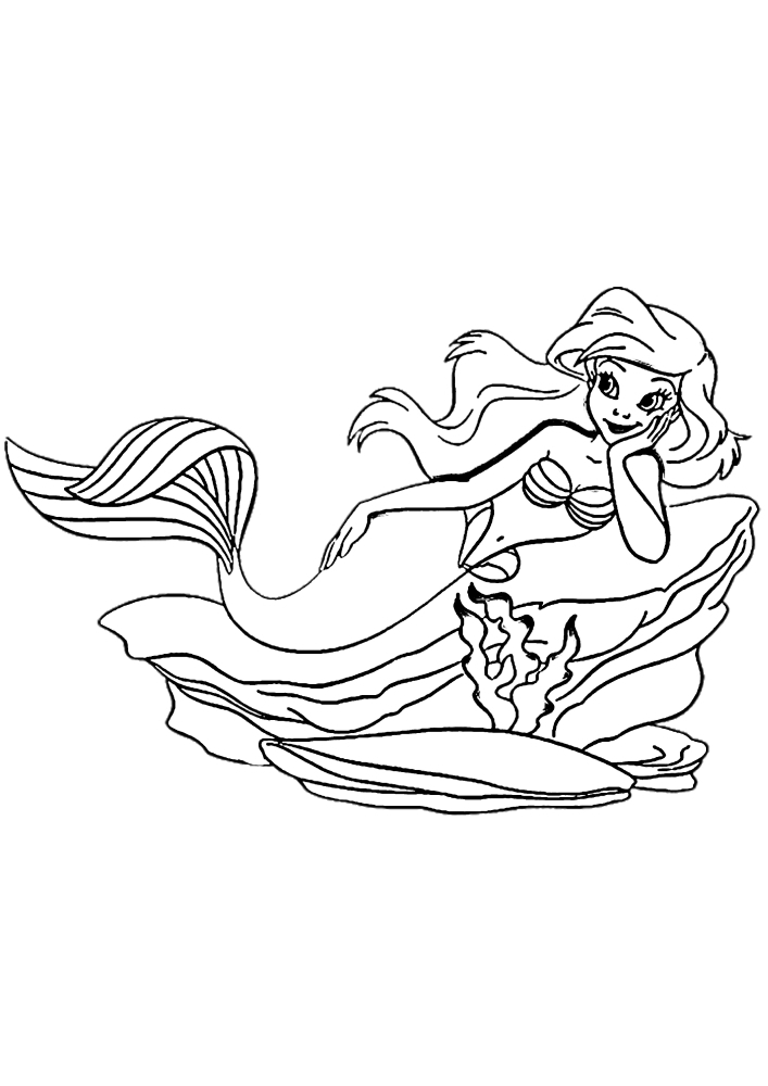 Ariel se repose sur les pierres-coloriage