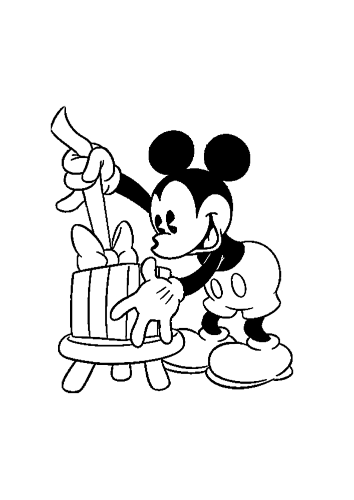 Mickey Mouse opens a gift for Christmas